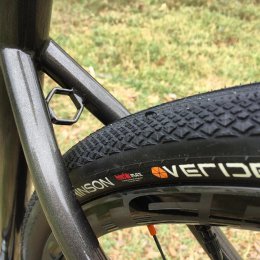 Steel frame, stiff rear triangle, fast rolling tubeless tires.
